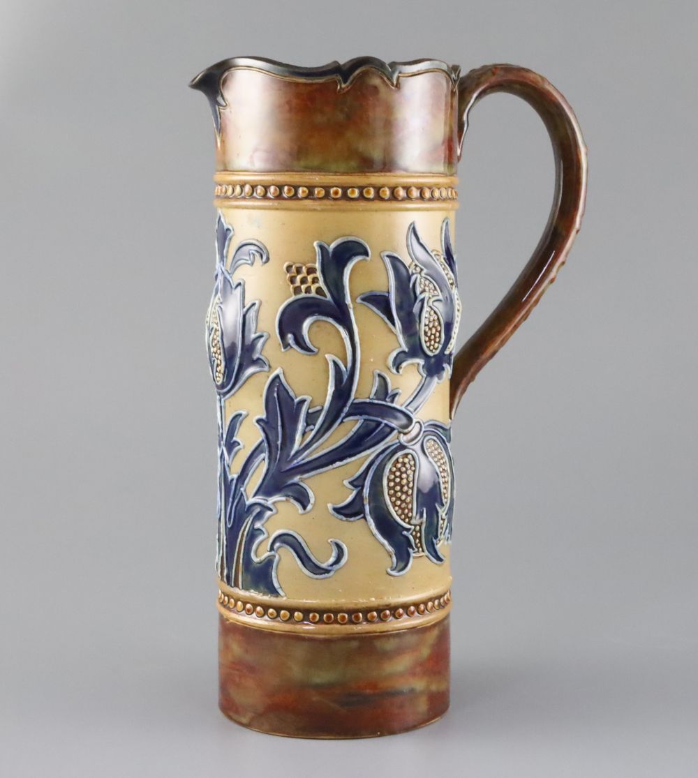 Mark V. Marshall for Doulton Lambeth, an Art Union of London jug, c.1895, the cylindrical body tube-lined with spikey flower and leaves